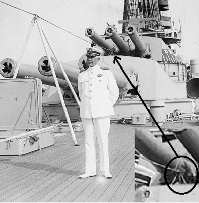 The center line passes through the large tripod  and ends on the small tripod on top of the turret.