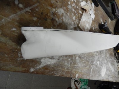 port bow, after initial sanding. Frames can be seen shining through, just where you need to get it. Shape can also be checked with "female" frames from the outside.