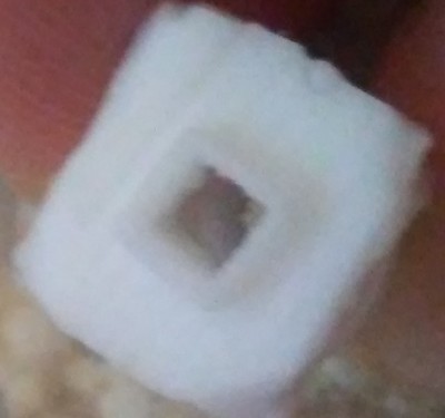 The stamp I created of the square hatch from parts of a resin copy of the bow deck.