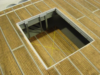 The aft elevator. Lines on the deck were taped off and airbrushed, then weathered with pastel chalk.