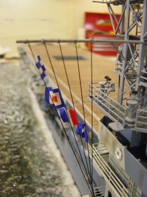 Signal halyards and flags. Yardarm is brass to minimize bending.
