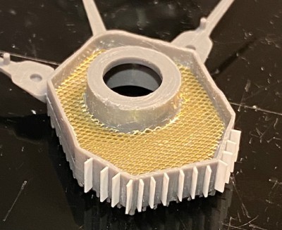 I am attempting to reproduce that effect with a fine brass mesh.  Also, the wind deflectors are crudely done, so I am attempting to improve them.