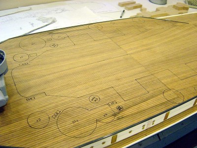 This photo shows the layout of most of the things that will be added to the deck, such as gun and director tubs, cable reels, r/s lockers, etc. I made a template from the plans to mark the locations of all these things. I then trace the template onto the deck. This saves alot of time versus measuring every piece for placement. The plans are pretty accurate, for 1/96 scale, so the template should be accurate. Thats not always the case, as sometimes the drawings are not correct. I try to cross check with photos of the ship where possible, to at least be close.