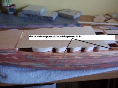 here the opening are cut out, i will use 3/8"styrene tubing for the gun mounts.walls are sheeted with .010 styrene