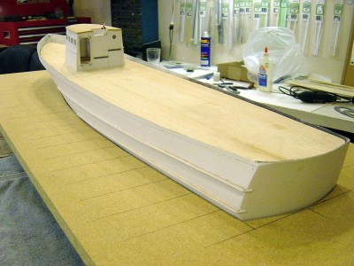 Portside aft, looking fwd. Again note the rubrails. Deck is 1/16" sheet balsa. I will cover this with 1/32" scribed basswood,to simulate the plank lines at 1/8" spacing, then add the camber to the deck using 1/8" balsa stick. More on that later.