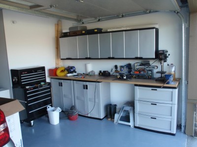 the black tool box is against the work room wall