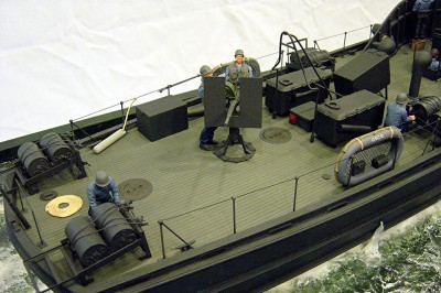 A view from stb. side aft here. Note the gunner and loader and the D/C crew. I have added the safety rail assy. between the 20mm ready boxes. Prevented shooting the mast off! Made from formed copper wire, soldered together. A tricky little piece to make. The addition of some crew starts to breath a little more realism into the project.