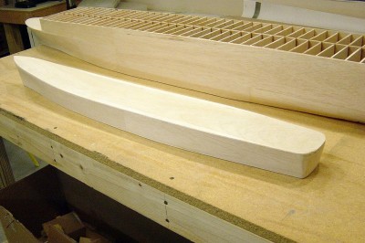 Port view of the DE. Covering this was a little different. Since the spacing on the hull sections was much greater than the CVE, I planked this first with 1/16" x 3/8" balsa strips. Then the second layer was added using the sheet goods. Deck is 1/8" hard balsa. Stern is rough shaped balsa block.