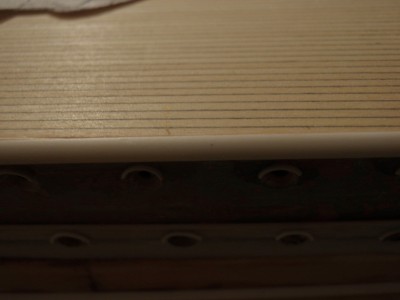 a piece of half round styrene,this matchs the rolled sides of sheer pretty close