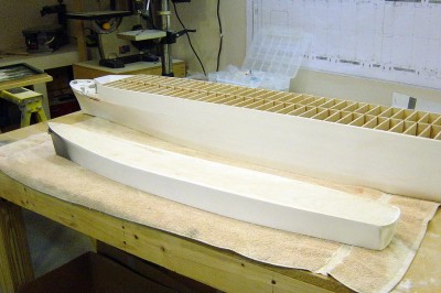 Another view here from a different angle. The DE's deck is still balsa. I will laminate it over with .030 styrene sheet before starting on the superstructure. Both hulls will soon be ready for primer coats, which will smooth things out even more.