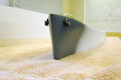 Another view here. I applied the filler to the edge of the styrene strip I added earlier, to get that sharp edge line. Anchors are cast metal.