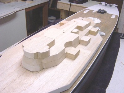 A view from portside. I felt that framing all these levels one by one and then covering them would be way too time consuming. I decided to use balsa blocks for the task. The problem was that the size of balsa I needed was not available from any standard supplier. I then remembered that the Guillow's company offers large balsa workboards which are used to build model aircraft on, or any other project that needs a flat, true surface. Interestingly enough, these boards are 1" thick, ( 8 feet in 1/96 ). Each level of the superstructure is also about 1".I was in luck!!