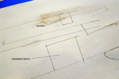 Along the hull sides, there are several recessed openings. Two are above the fwd. and aft sponsons, and are access ways to the hanger deck via double w/t doors. The others, 4 in all, are louvers which have fans behind them for hanger deck ventilation. I have marked their locations along the hull, and will now cut these out.