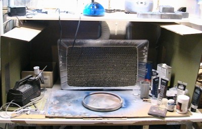 My cardboard and Mr. Spray Booth setup. The fumes extractor pipes out to a window fan unit that sucks the fumes out to the backyard.