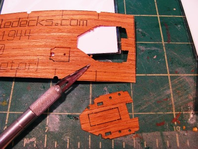 The deck removes fairly easily with a sharp X-acto blade, and is ready to be test fitted onto the kit part