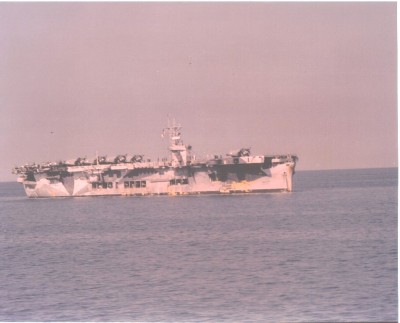Another view of the ship. SBD's, F4F's and TBF's on deck. Note the openings on the sides of the ship. This was the main deck of the tanker. Also note the weathering. Photo was taken enroute to North Africa during late October 1942.