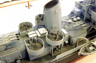 Midships 20MM location here. Guns are cast metal while the other parts are p/e brass. Just behind the stack is a vent, then a spare barrel box, then two ready service lockers. I cast the w/t doors from resin and added the handreel, an HO freightcar brakewheel. Note the perforated deck on the fwd. 20MM mounts.