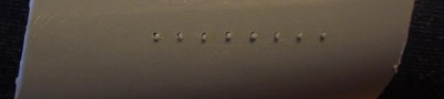 And here is a closer look at some test holes drilled. Pieces of plastic rod has been placed in the holes, to support a footrail, which was what I wanted to test for at the time.