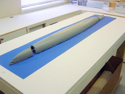In order to make this waterline, the first order of the conversion was to cut the hull at the waterline after assembly. I left the decks and side plates off at this point. Shown here is the lower half, cut in three pieces.