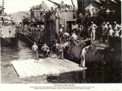 Haggard_DD555_02 under repair of starboard hull at Kerama Retto after 4-29-1945 Kamikaze attack.jpg