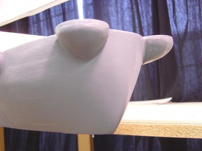 Stern view here. A bit rough yet, but you get the idea. Note the support sponsons for the 40mm aft quads. Made from air dry clay. Much to be done yet. Stern was formed in with autobody filler. Again, this is just the rough in, I'll fine tune things soon.