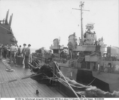 The person on the pilot house roof port side appears to be next to or atop the subject structure.