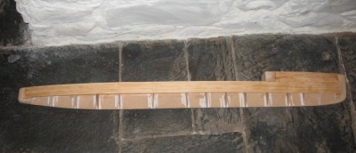 The planking stops at the bow and stern block.