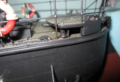 The rudder linkage, beneath the aft raised deck.