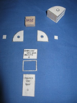 The companion way components taken from the printed sheet. The balsa wood base made construction and handling easier.