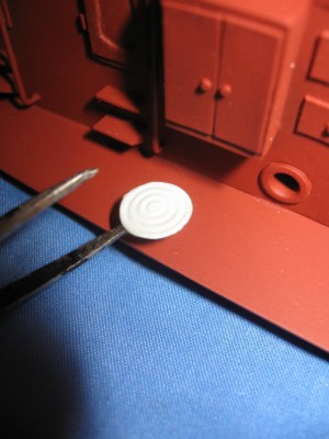 The circular coaling scuttles are embossed into self adhesive aluminium foil to render them "flush" with the deck.
