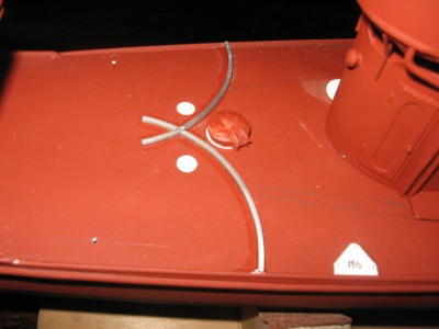 The forward torpedo tube positions. The deck races are now installed.
