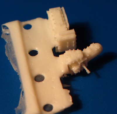 The base and the gun fit into each other very nicely, and you can rotate it up and down as you wish - see photo below.