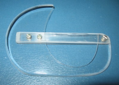 The rudder extension made from clear acrylic. The two horizontal strips are thinner more flexible plastic which grip the rudder.