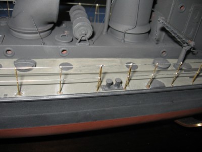 The stanchions are being fitted, and the deck is being hand painted.