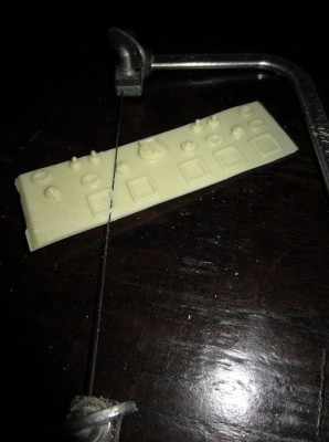 A fine blade fret saw is the best method of removing the fittings from the "casting base".