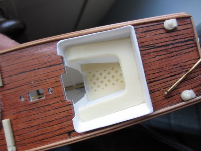 The resin cast seat cushions and floor grating were installed together with the the steering cable pulleys on the aft deck.