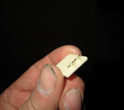 The brass cross wire was inserted through both cleats before being trimmed off.
