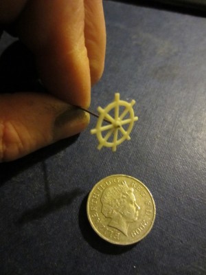The wheel is CA glued to a length of 0.5mm brass wire.