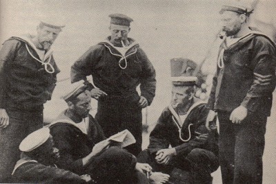 Note how many crew are bearded. They also have lanyards around their necks. Some men are wearing their "frock" tucked into the trouser top. One man has a different hat style.
