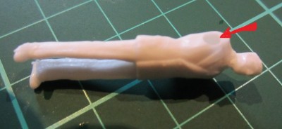 This figure (officer) is having an arm removed an re-modeled. Drilling a hole into the torso helps the newly created arm "key".