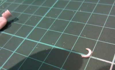 A hole punch was also used to create the a small crescent used for the peak of the hat.