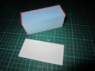 The tape was removed along with the front wall of the box.