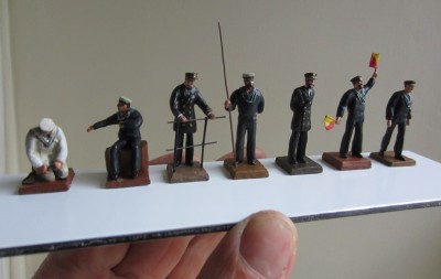 001 (3).JPG (164.83 KiB) Viewed 10905 times The finished and painted RN crew c1900. The officer (third from left) is holding a section of deck edge railings not a walking aid!
