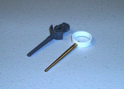 Pictured here is an original Lindberg kit's barrel along side an accurately scaled replacement brass barrel by the late Steve Nuttall.  Notice the kit barrel is too fat and too short.  The kit's barrel also sits too far back inside the gunhouse when installed making the gun look noticeably stubby.