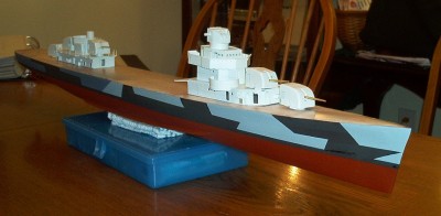 The turrets and deckhouses aren't yet fixed; they are just in position for picture purposes.  The 5-inch turret barbettes aren't yet made so the turrets aren't sitting level in these pics.