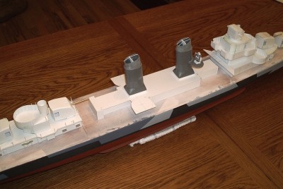 The deckhouse bulkheads and "roof" are made from .040 Evergreen styrene sheet.  Once the "roof" is fixed into position the edges will be trimmed flush.