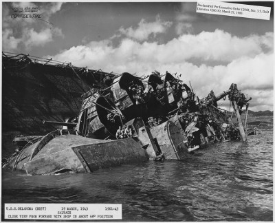 USS_Oklahoma_(BB37)_19_March_1943,_1561-43,_Salvage,_Close_view_from_forward_with_ship_in_about_68_degrees_position_-_NARA_-_296973.jpg