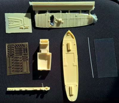 Overview of all the parts that come in the box. Styrene rod for the flag poles on the right, as is a piece of clear acrylic for window glazing. The PE is nice, but the holes in the lifeline stanchions are not etched all the way through, so some work will have to be done to allow lifelines to be rigged.